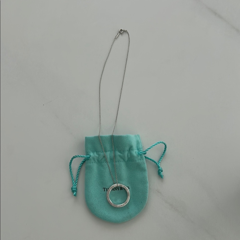 Tiffany & Co. Silver Circle Pendant with Blue Pouch